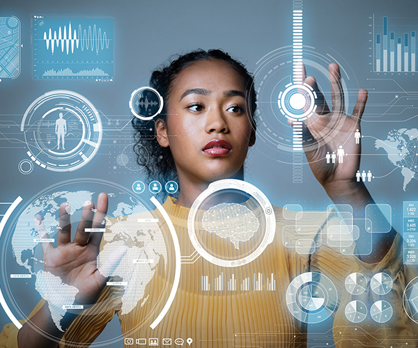 young person in front of touch screens