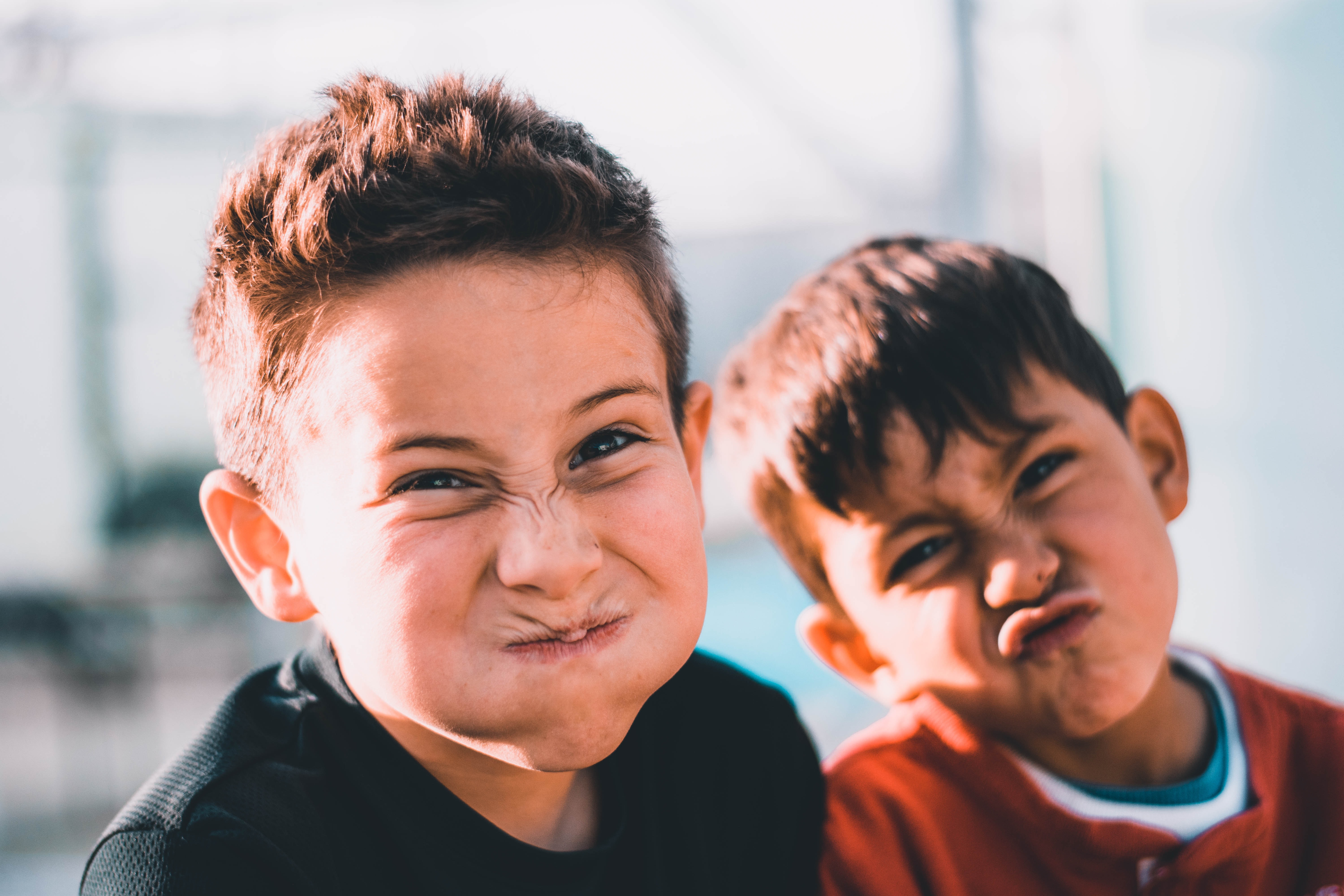 two boys making silly faces at camera