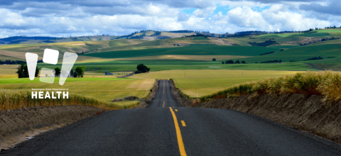 Landscape image of a road in a rural area.
